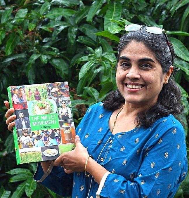 Sanjeeta KK holding "Millet Movement in India"